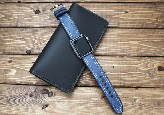 Black leather wallet with a blue strap on