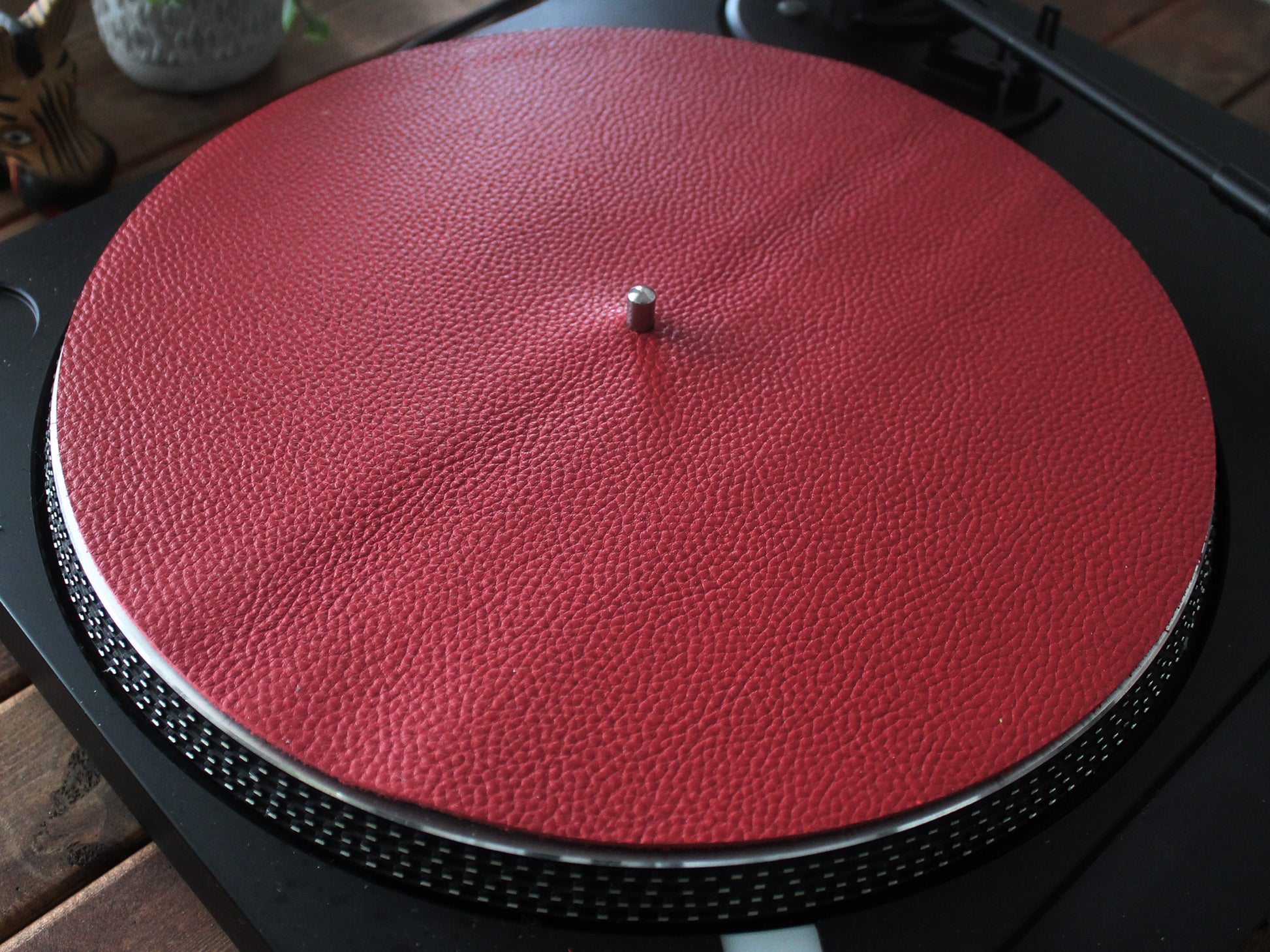 A red full grain leather turntable platter slip mat