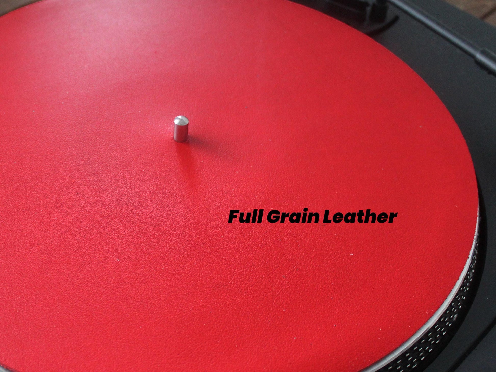A red full grain leather turntable slip mat