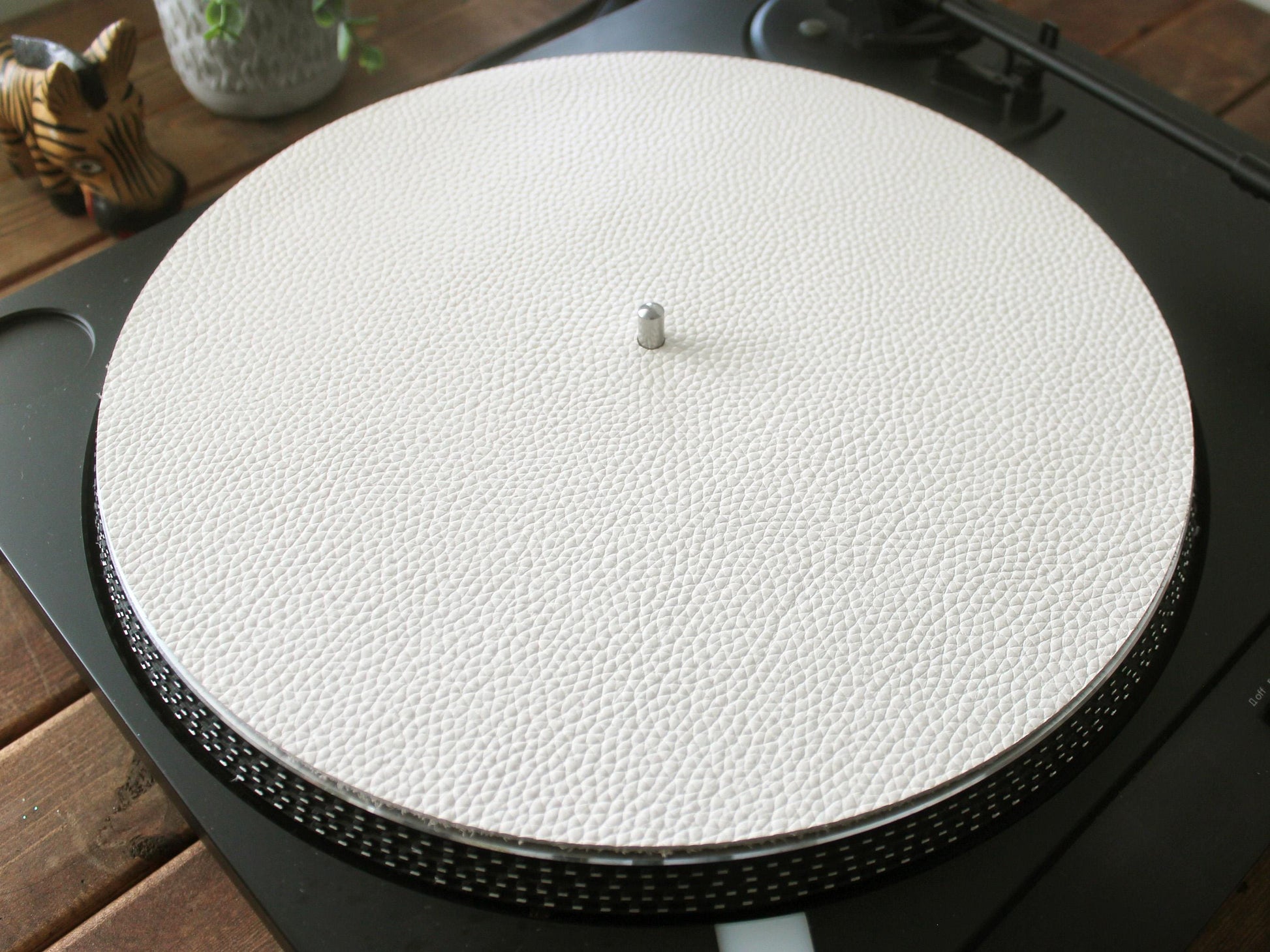 A white full grain leather turntable slip mat