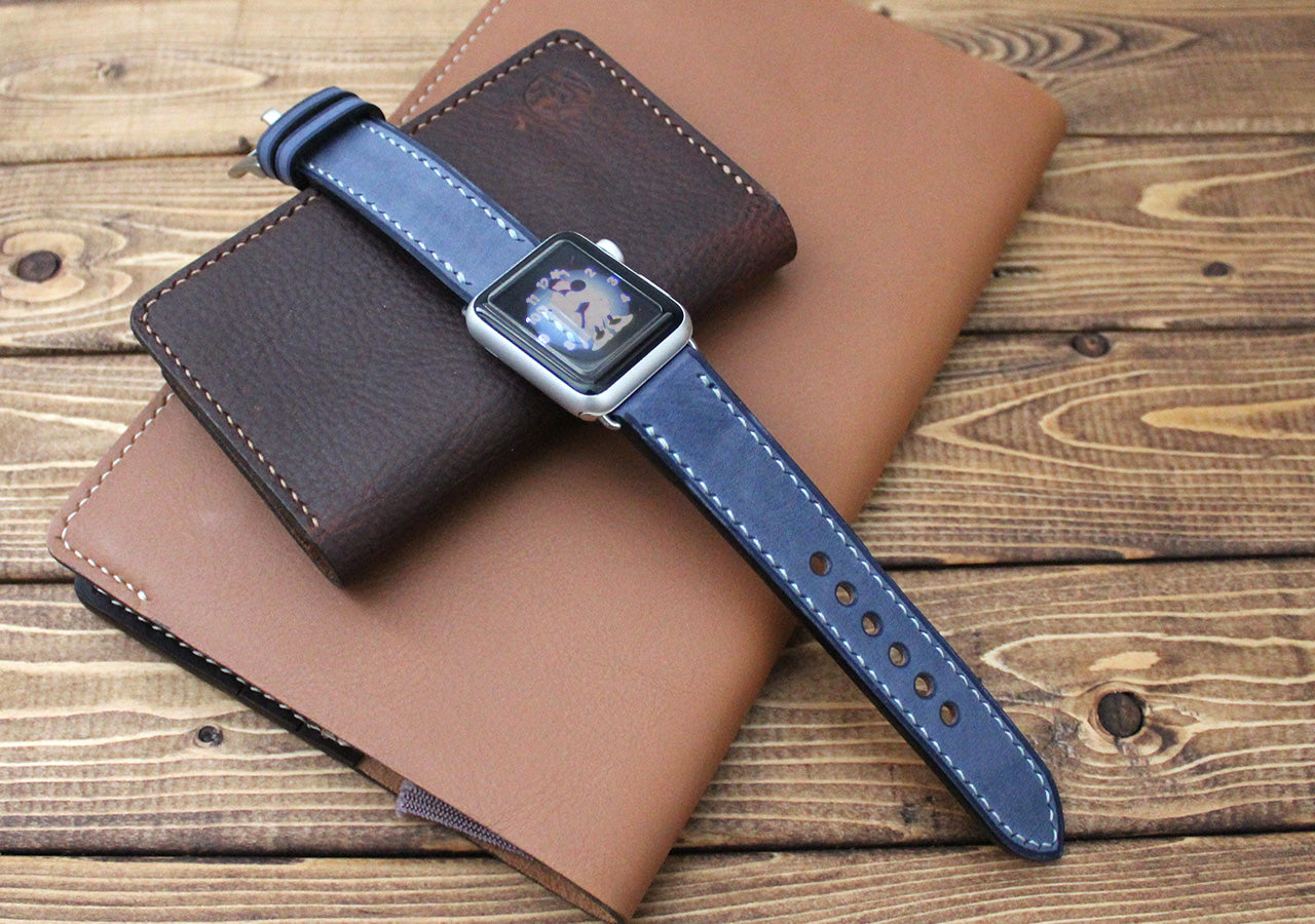 Apple watch with a Italian blue leather strap on a brown leather case