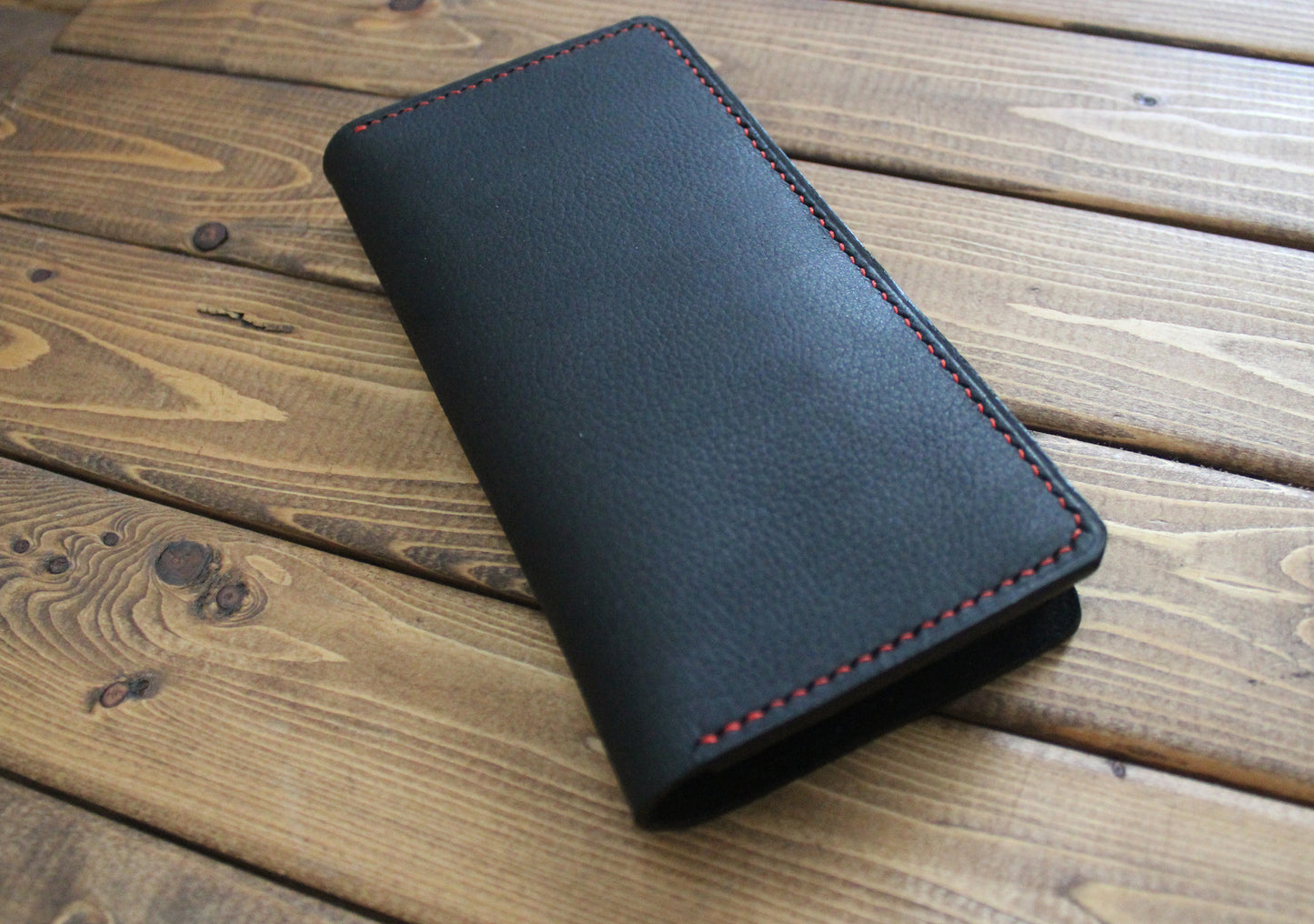 full grain Black leather wallet with red stitching 